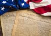 DSA Vows To CUT UP Declaration of Independence United States founding documents with American flag
