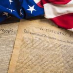 United States founding documents with American flag