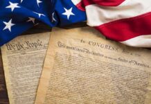DSA Vows To CUT UP Declaration of Independence United States founding documents with American flag