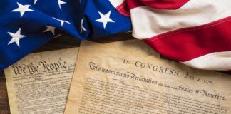 United States founding documents with American flag