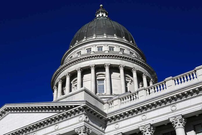 shutterstock_1020176086 Capitol building dome with columns against a deep blue sky