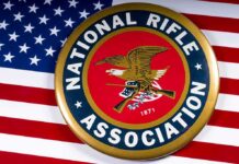 Judge REVOKES 90-Year Gun Ban – 2nd Amendment Stunner NRA emblem on American flag background