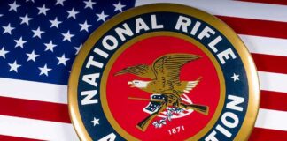 NRA emblem on American flag background