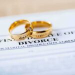 Republicans Push To End No-Fault Divorce Gold wedding rings on a divorce document