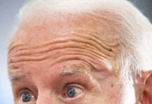 Biden Aide VANISHES After Supporting Republican older man speaking in close-up portrait