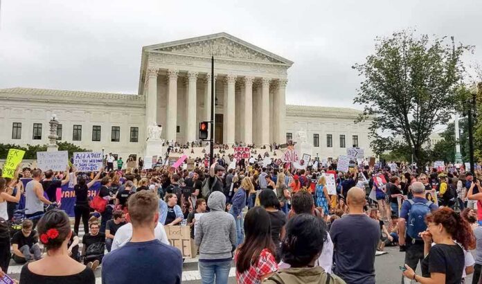 David Givens at a large protest outside a neoclassical courthouse
