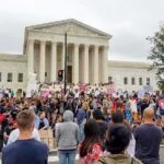 Sharia Law Now RULES U.S City David Givens at a large protest outside a neoclassical courthouse