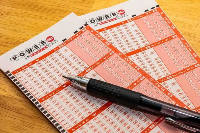 Powerball lottery play slips with a black pen