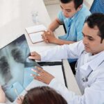 Doctors reviewing a chest X-ray at a desk