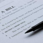 House Votes 308-117, Daylight Saving Time Decision Reached! Bill document with pen on paper