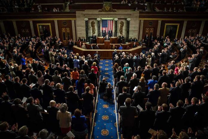 Legislative chamber audience stands and applauds