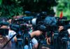 Dem Senator Praises Trump At GOP Convention TV news cameras crowding together at an outdoor event