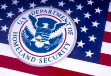 Homeland Security Lied About Child Porn To Search Activist’s Phone U.S. Department of Homeland Security seal on American flag