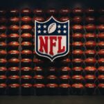 NFL shield logo over wall of footballs