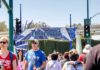 Dead Body Found Outside Disneyland Entrance! Crowd walking past a Disneyland Resort entrance sign