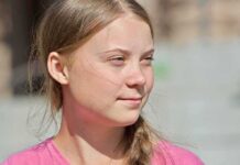 You Won’t Believe Who Just Joined Paris Protests young woman with braid looking to the side outdoors