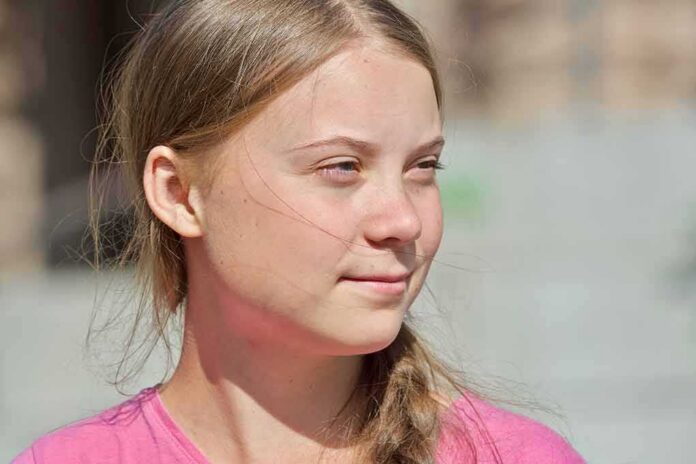 shutterstock_1503852359 young woman with braid looking to the side outdoors