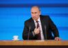 Vladimir Putin at a podium with two microphones
