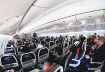 Israeli Hijackers Explosive Religious Rants Surface Airplane cabin with passengers seated in economy class