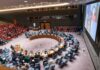 Trump Slaps ICC After Ex-Judge Wins Nobel Delegates seated around a circular conference table in a large chamber