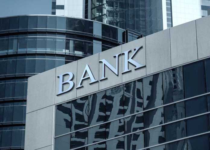Bank building facade with large sign and glass windows