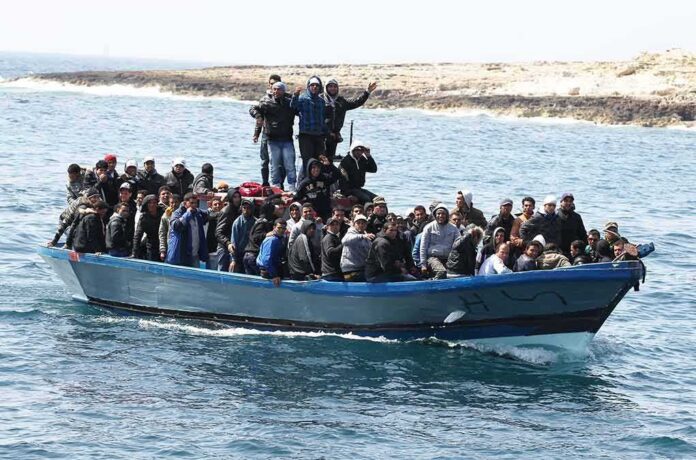 Crowded blue boat at sea with Ivan Morales Jr., Andreas Hestler, Isaiah Frey, Christian Jones, and Teddy Williams among passengers